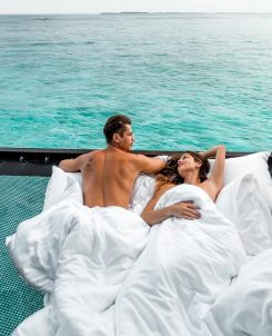 Sheraton Maldives Full Moon Resort & Spa Couple In Overwater Villa