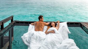 Sheraton Maldives Full Moon Resort & Spa Couple In Overwater Villa