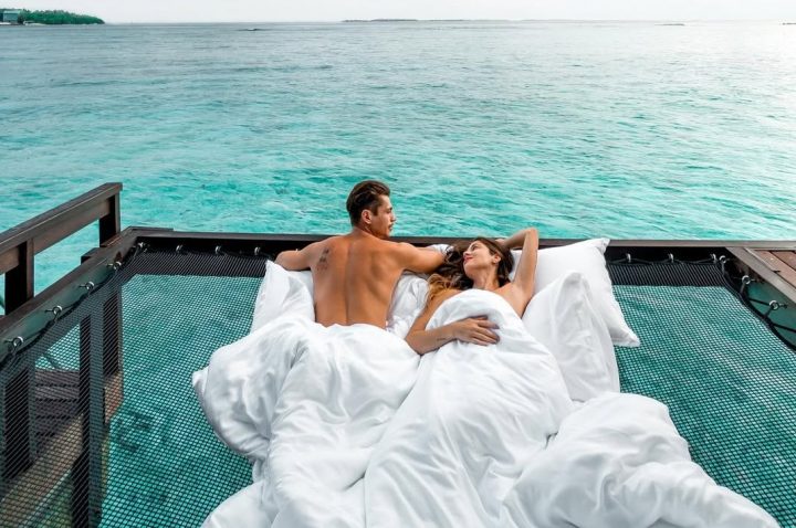 Sheraton Maldives Full Moon Resort & Spa Couple In Overwater Villa