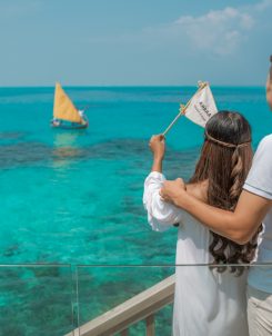 Batch Avani Plus Fares Maldives Resort Ambaa Cocktail Boat Couple Waving Ambaa Drink Flag To The Boat