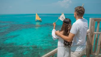 Batch Avani Plus Fares Maldives Resort Ambaa Cocktail Boat Couple Waving Ambaa Drink Flag To The Boat