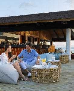 The Westin Maldives Miriandhoo Resort Couple At Sunset Bar