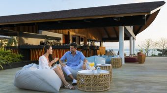 The Westin Maldives Miriandhoo Resort Couple At Sunset Bar