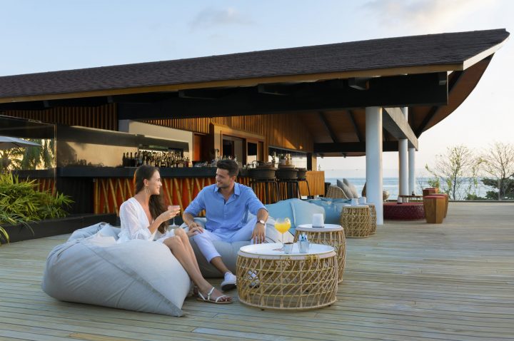 The Westin Maldives Miriandhoo Resort Couple At Sunset Bar