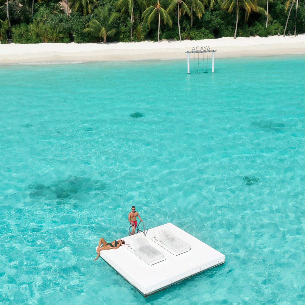 Couple On Floating Sunbed