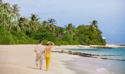 The Westin Maldives Miriandhoo Resort Couple Beach Walk