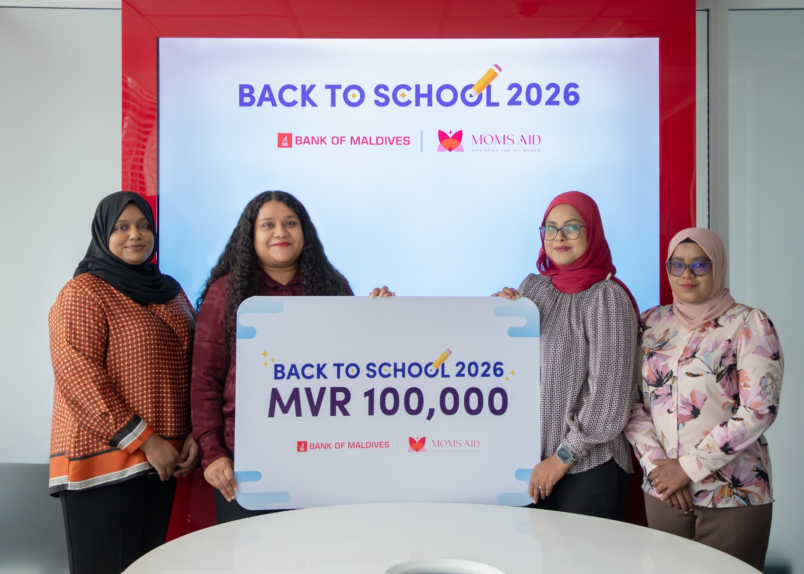 BML supports MOMS Aid with MVR 100,000 donation for Back to School drive