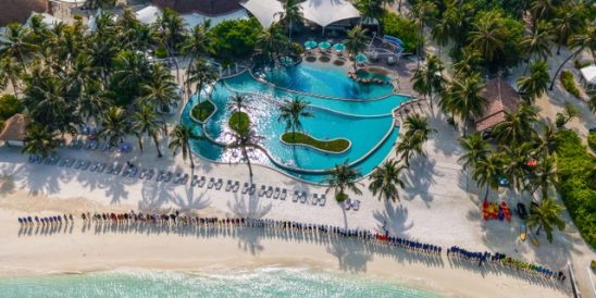 Kandooma Team line the beach