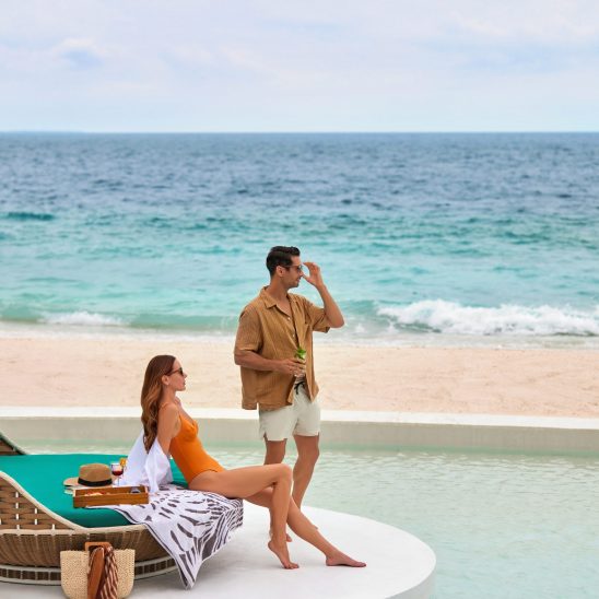 The Westin Maldives Miriandhoo Resort Couple At The Poolside