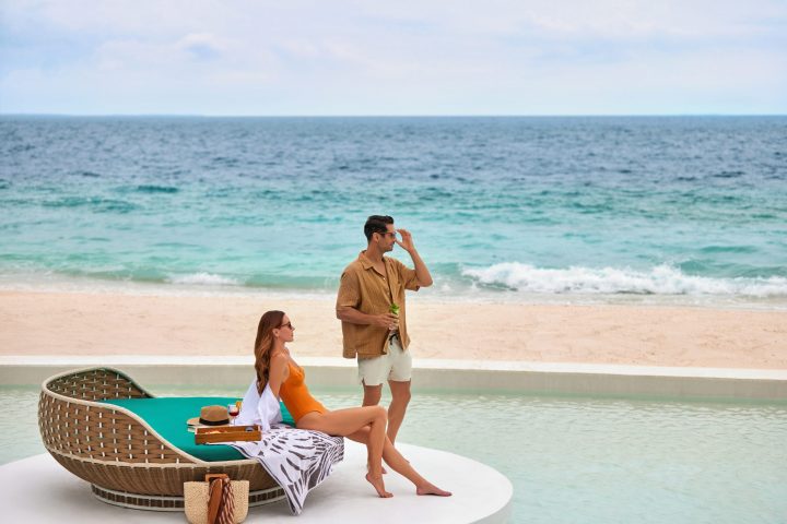 The Westin Maldives Miriandhoo Resort Couple At The Poolside