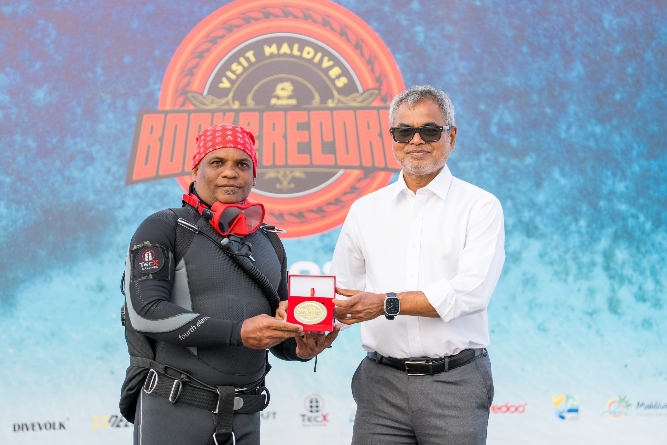 Diver Shafraz Naeem enters Visit Maldives Book of Records with two underwater achievements