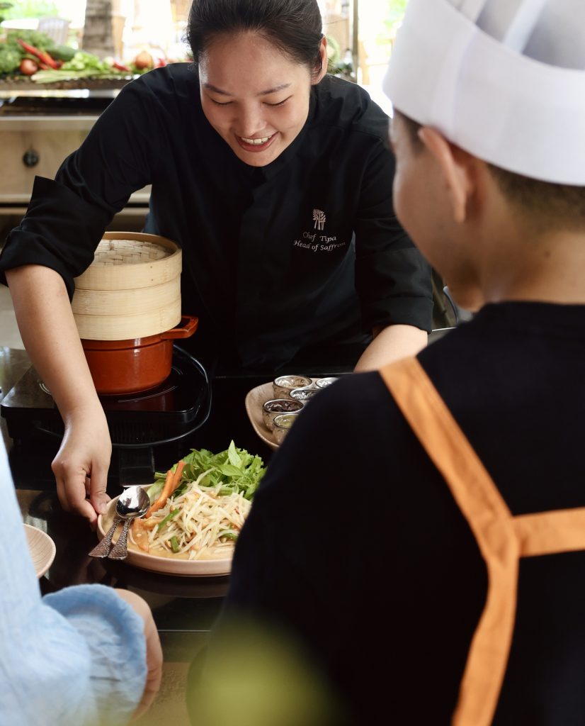 Chef Tipa at a cooking class with guests