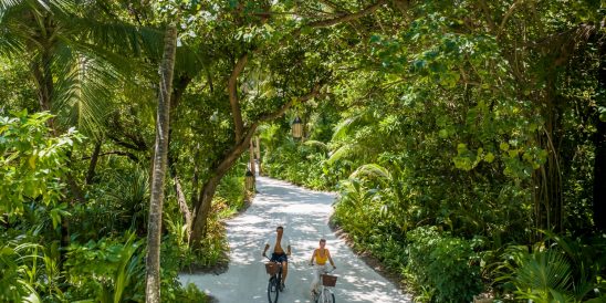 Batch Niyama Private Islands Maldives Couple on The Bike Greenery