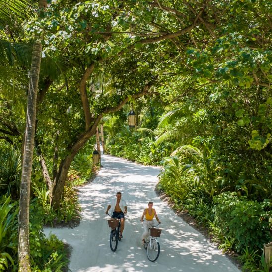 Batch Niyama Private Islands Maldives Couple on The Bike Greenery