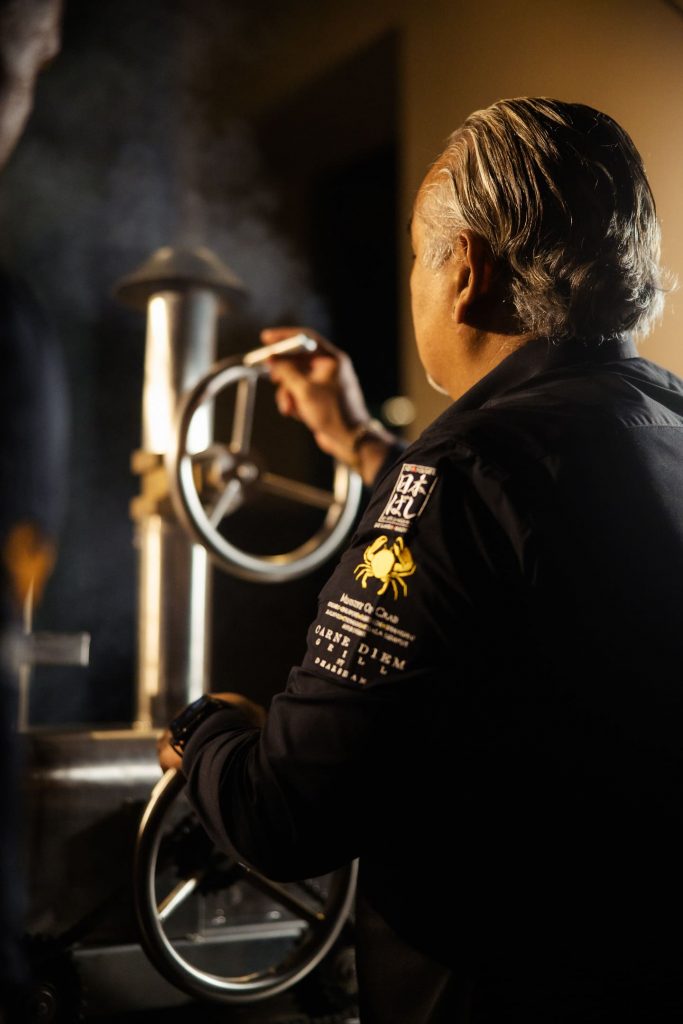 Chef Dharshan operating the grill Ignis Maximus