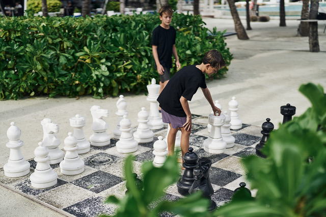 AqB Boys playing beach chess