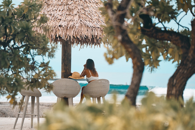 AqB Lady sitting at Surf Corner